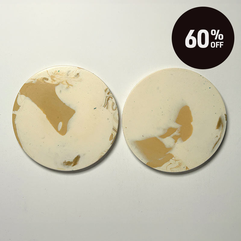 Two round coasters with a cream and tan marbled design, displayed side-by-side on a light gray background with a black '60% OFF' promotional badge in the top right corner.