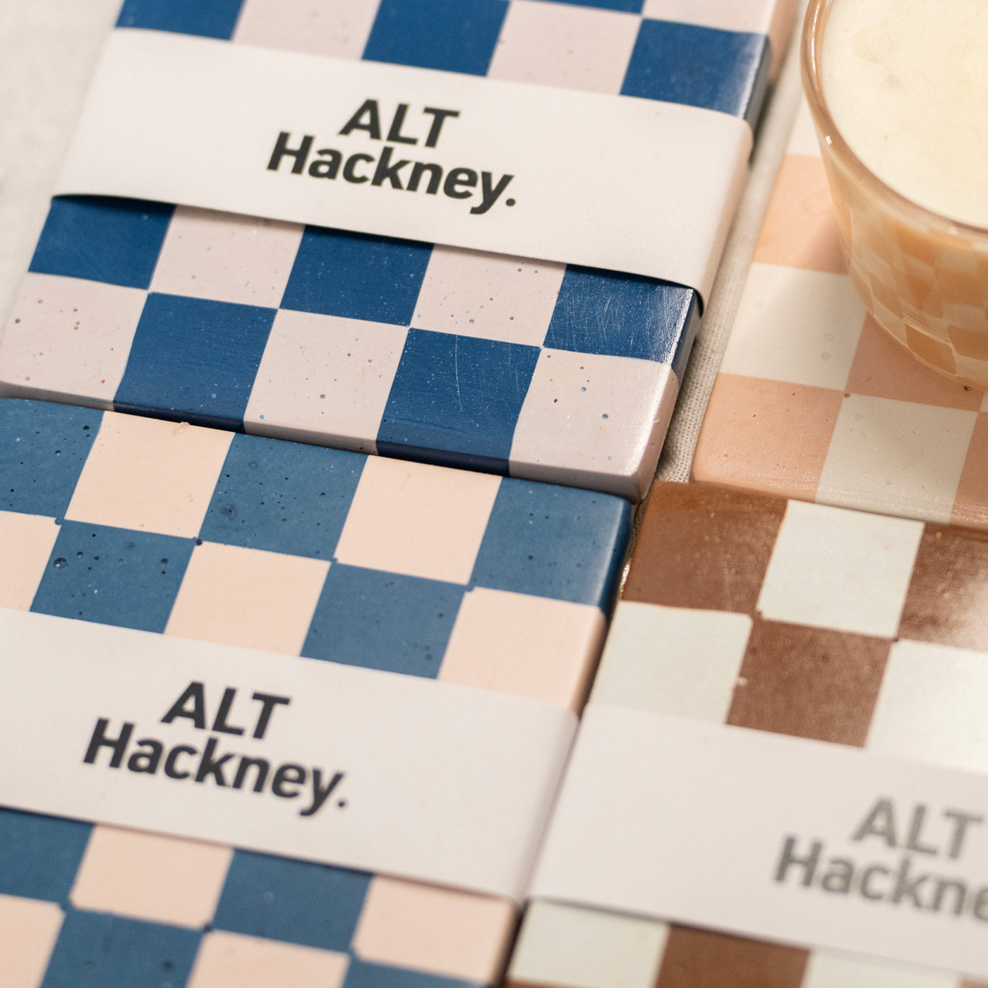 Selection of ALT Hackney chequered coasters on display