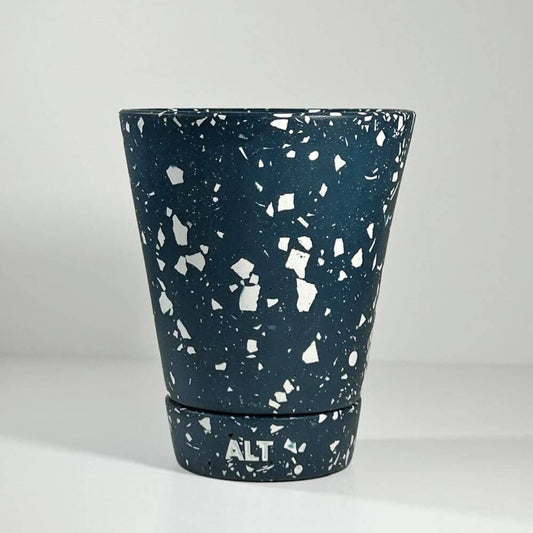 Navy terrazzo planter pot with 'ALT' branding on a light grey background