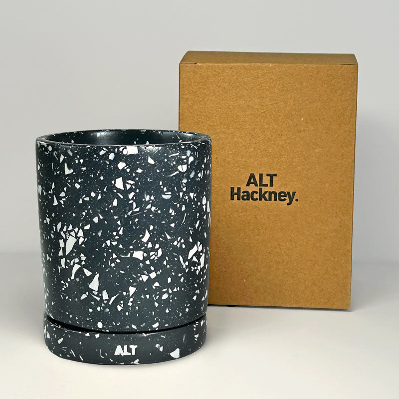  Navy with white terrazzo planter with 'ALT' branding next to a brown box on a white background