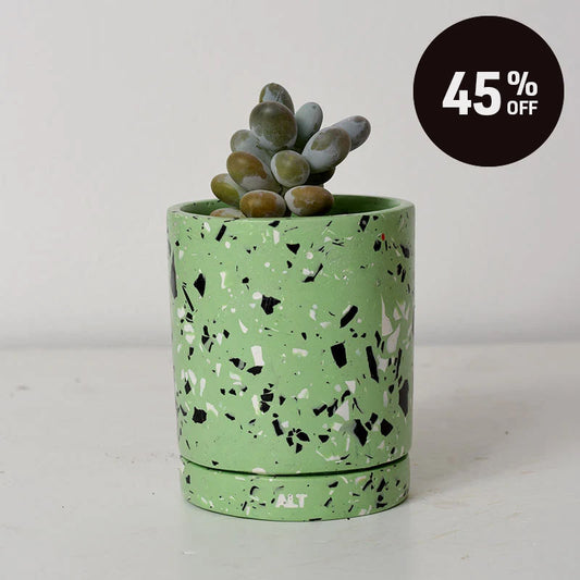 A green terrazzo planter with black and white flecks, containing a small succulent plant, set against a plain light gray background with a black '45% OFF' promotional badge in the top right corner.