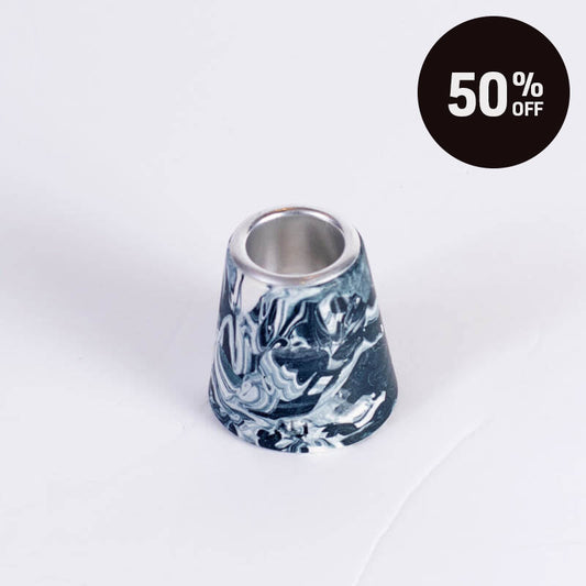 A marbled Navy and white small taper candle holderwith a silver metal inner rim, shown on a white background with a black '50% OFF' promotional badge in the top right corner.