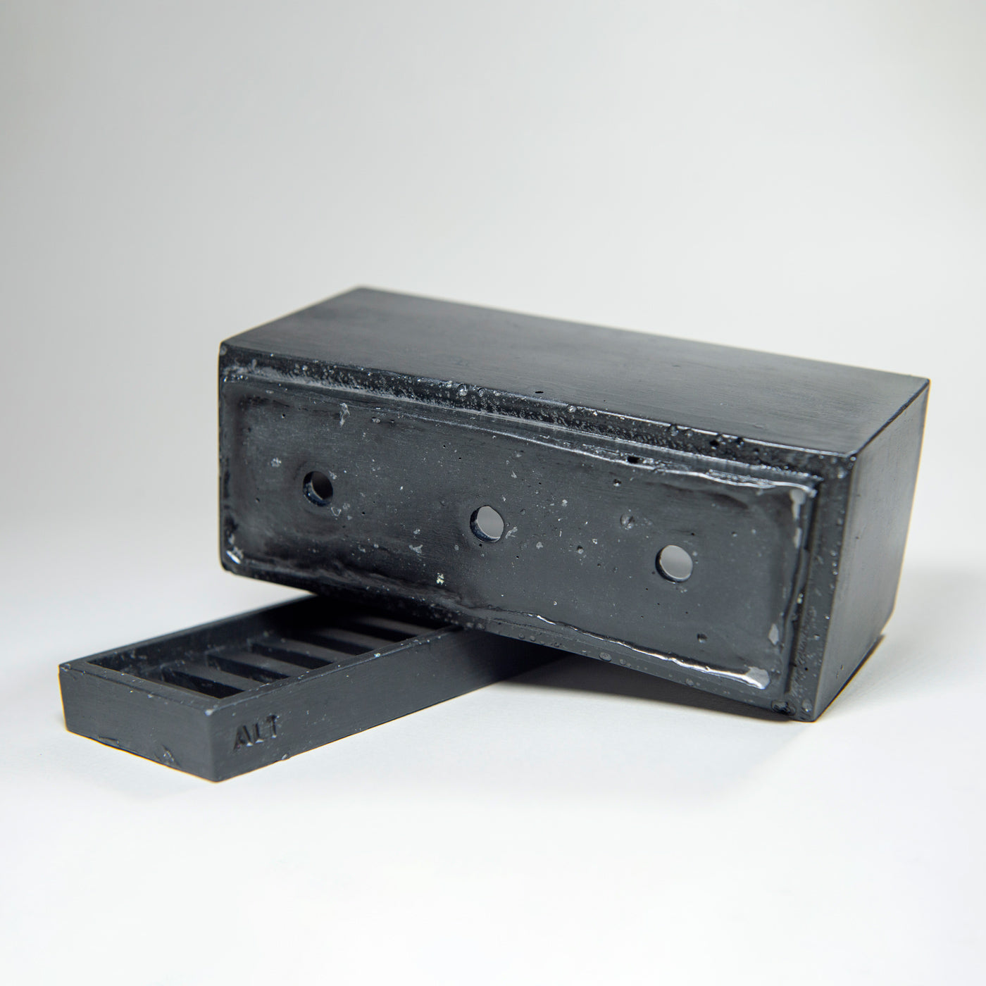 Rectangular black planter with drainage holes and a water tray box with 'ALT' branding on a white background