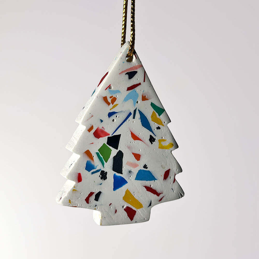 Rainbow terrazzo tree-shaped Christmas decoration on a white background