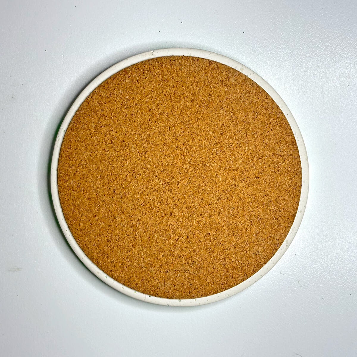 Round cork coaster on a white background