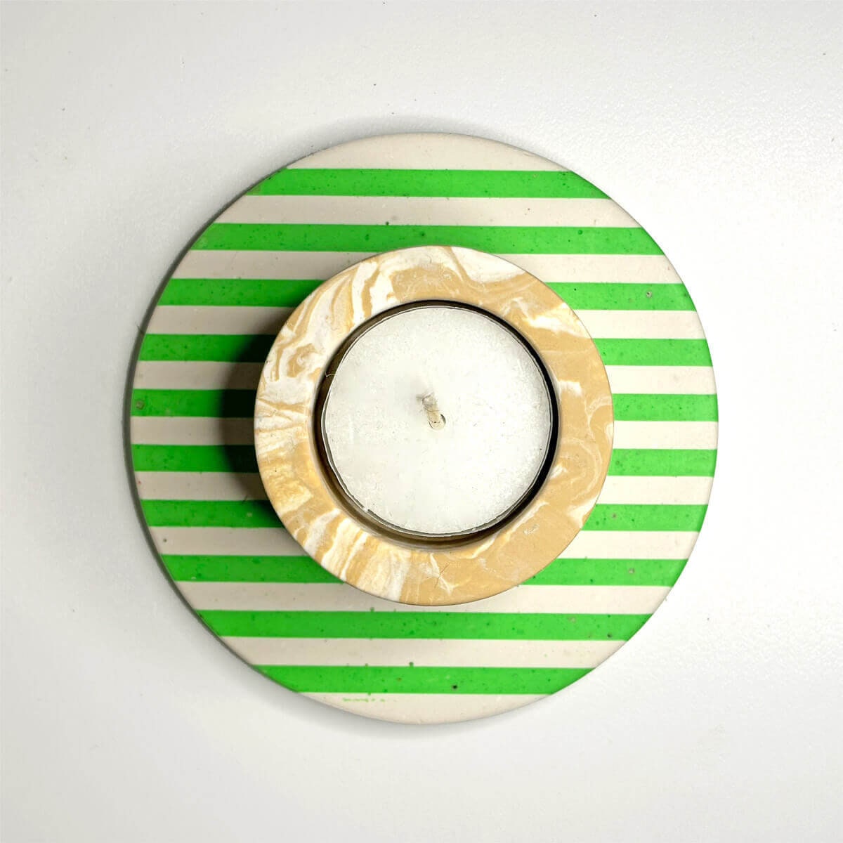 neon green and white stripe coaster with a  tea light candle holder