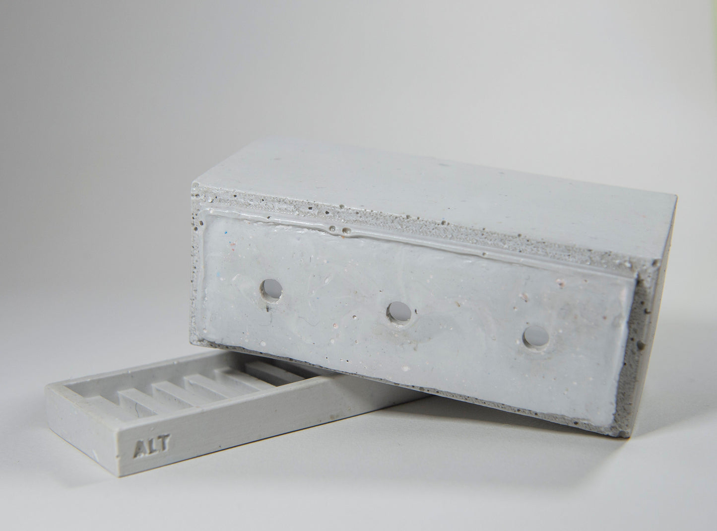 Rectangular grey planter with drainage holes and a water tray box with 'ALT' branding on a white background
