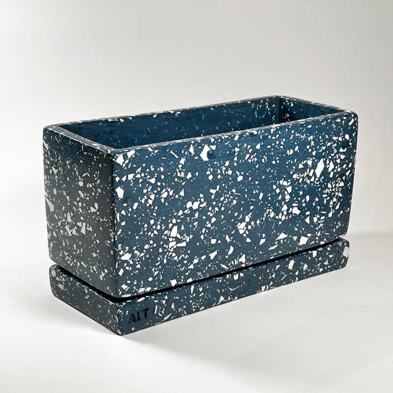 Navy rectangular terrazzo planter with drainage holes and a water tray on a white background