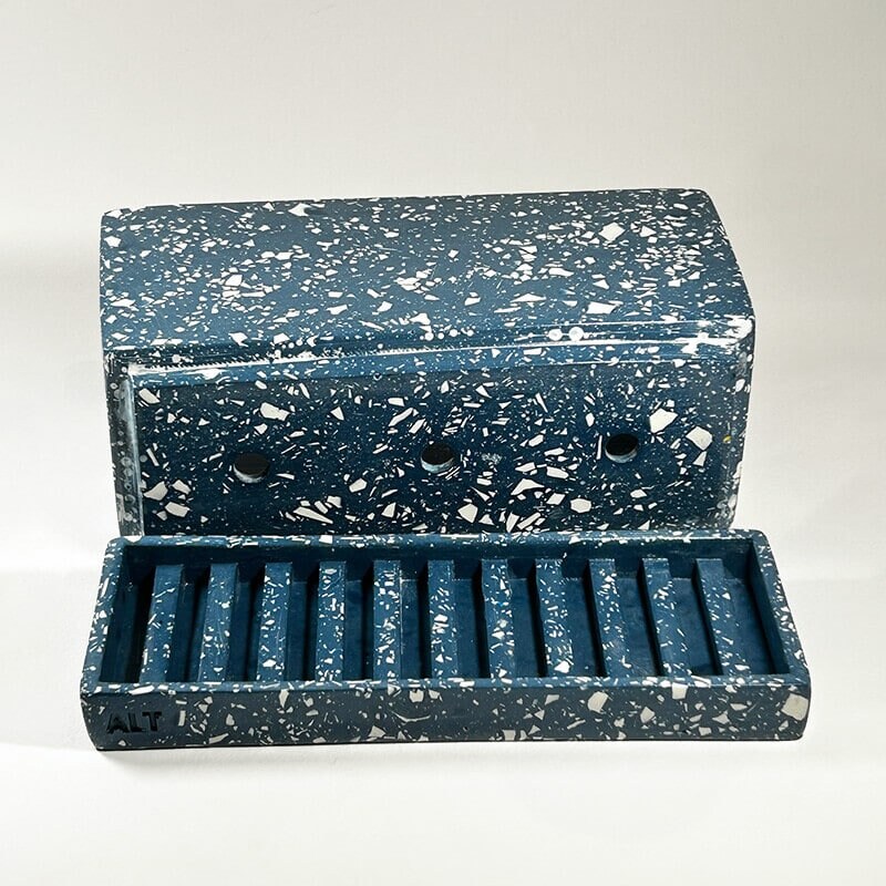 Navy rectangular terrazzo planter with drainage holes and a water tray on a white background