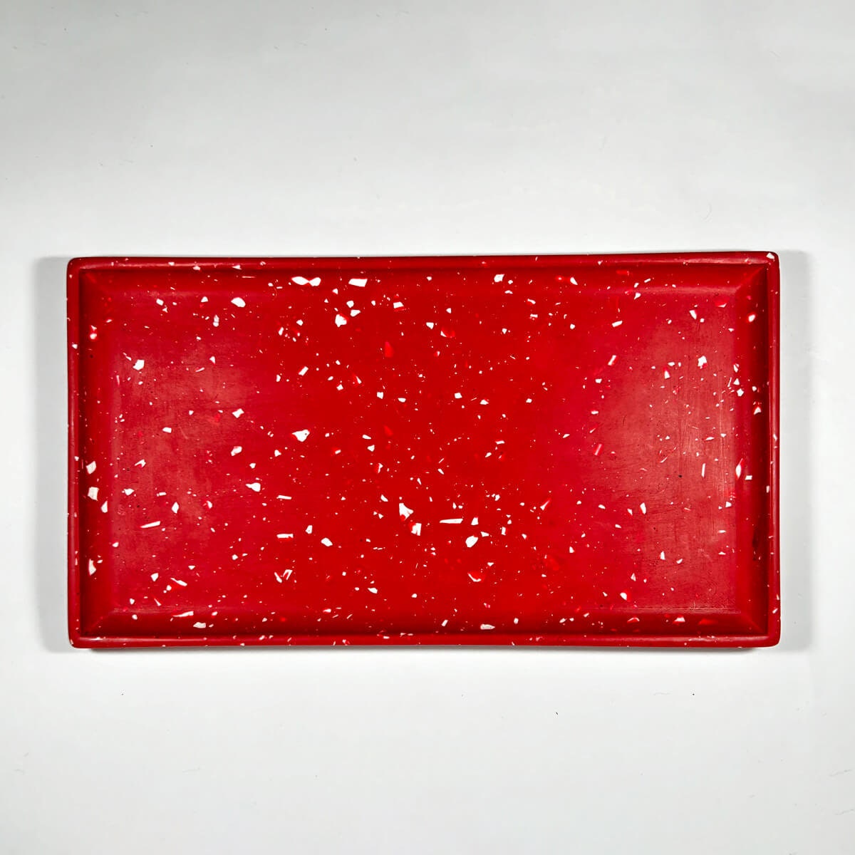 Red terrazzo tray on a white background