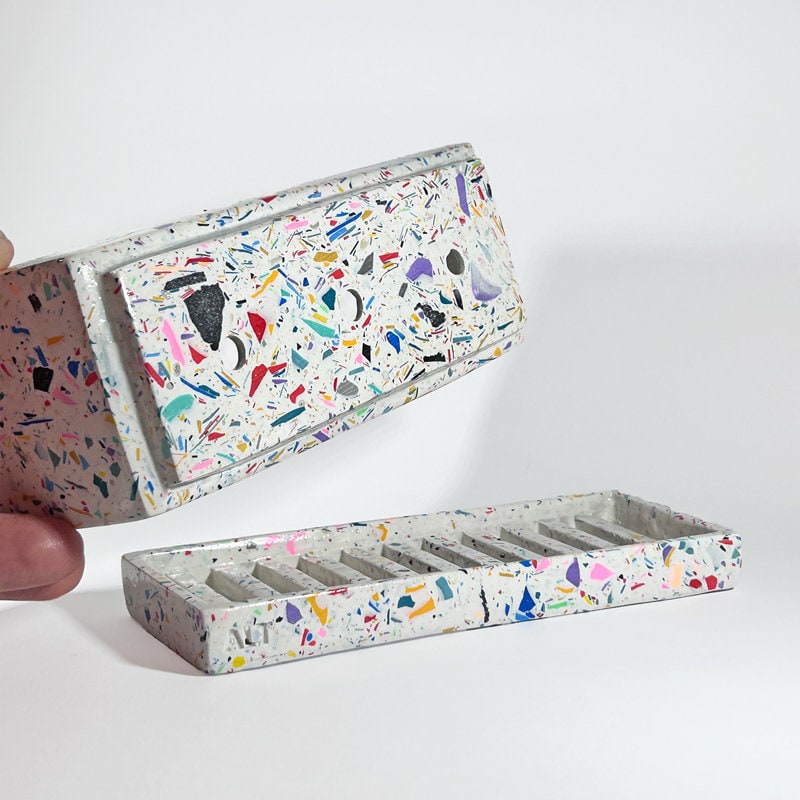 Colorful speckled makeup tray with a matching case on a white background