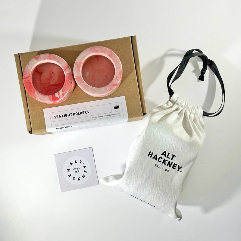 Tea light holders in a box with a drawstring bag labeled 'ALT HACKNEY' on a white background.