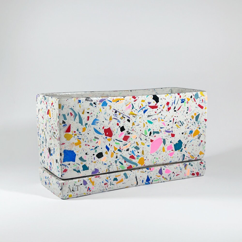 Rectangular rainbow colourful confetti terrazzo planter with drainage holes and a water tray box on which background