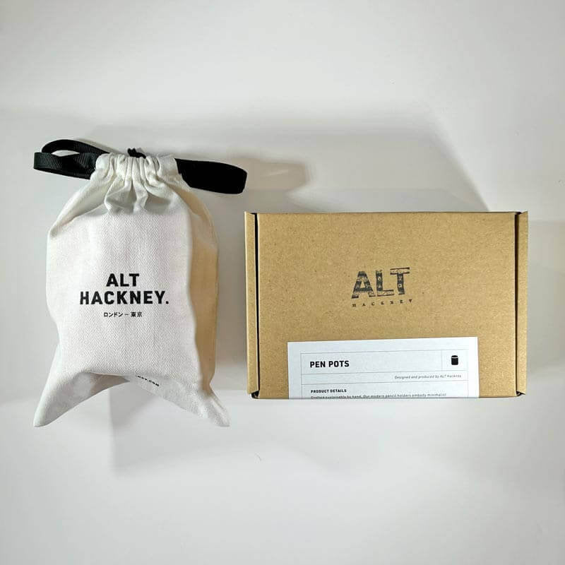 White drawstring bag and brown box with 'ALT HACKNEY' branding on a white background
