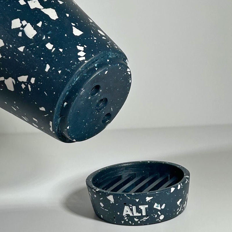 Navy terrazzo planter pot with 'ALT' branding on a light grey background