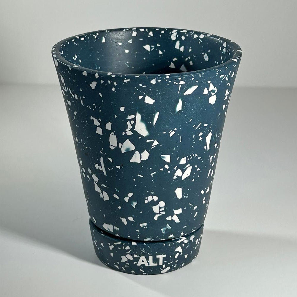Navy terrazzo planter pot with 'ALT' branding on a light grey background