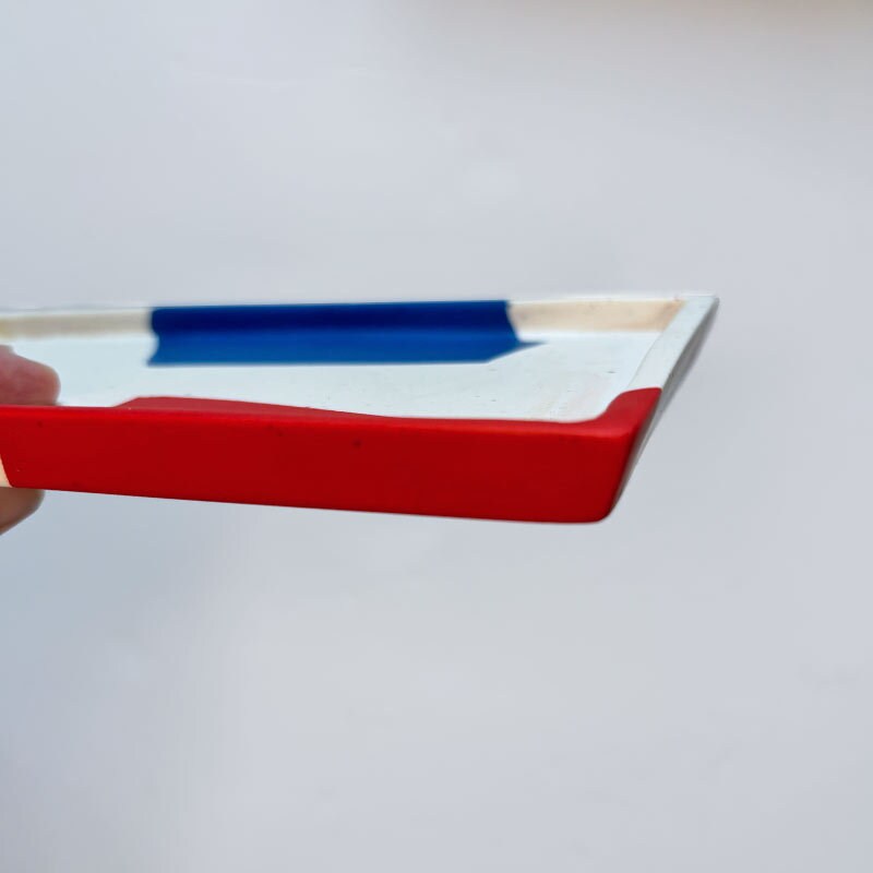 Rectangular tray mat with red, white and blue colour on a white background
