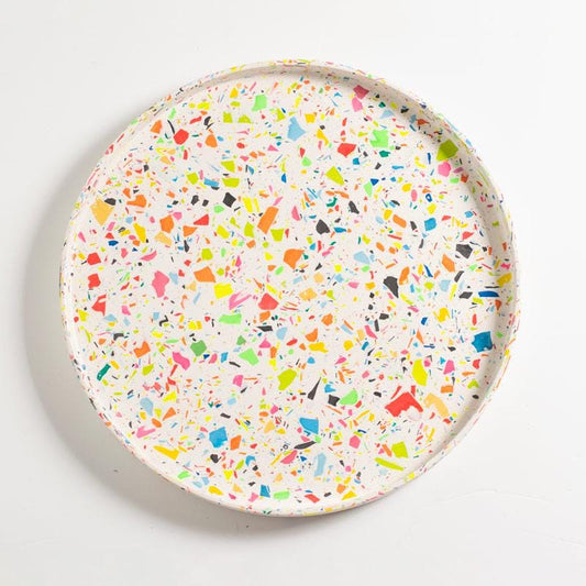 Round rainbow confetti terrazzo decorative tray on a white background