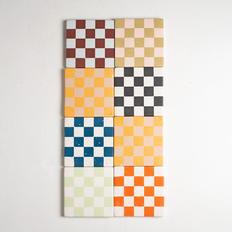 Colourful checkered coasters on a light grey background