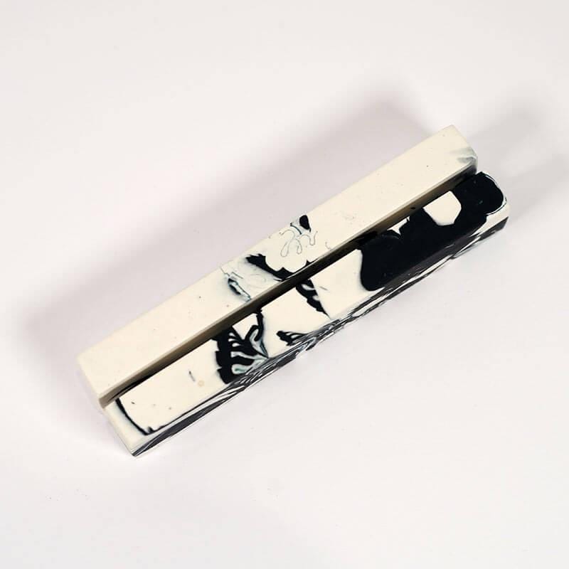 Tie clip with butterfly design on a white background