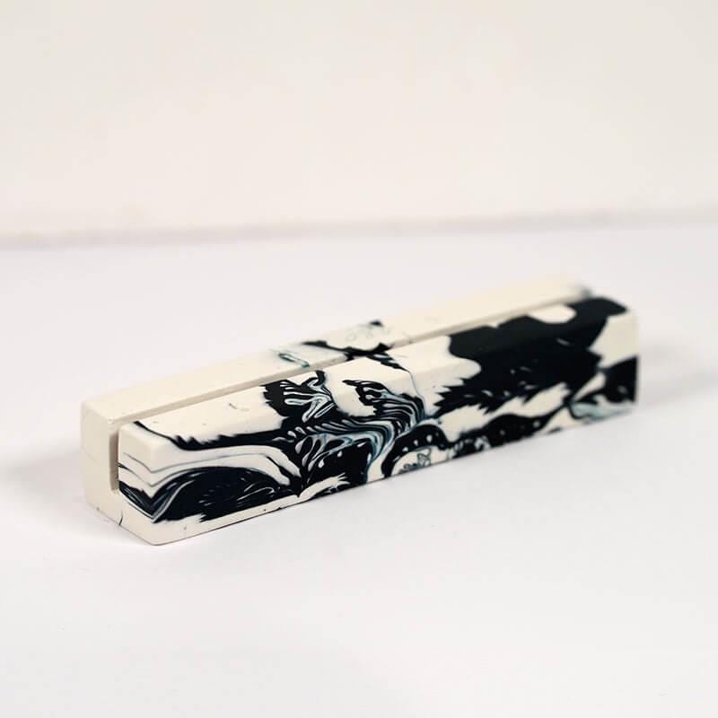 Marble-patterned rectangular object on a white background