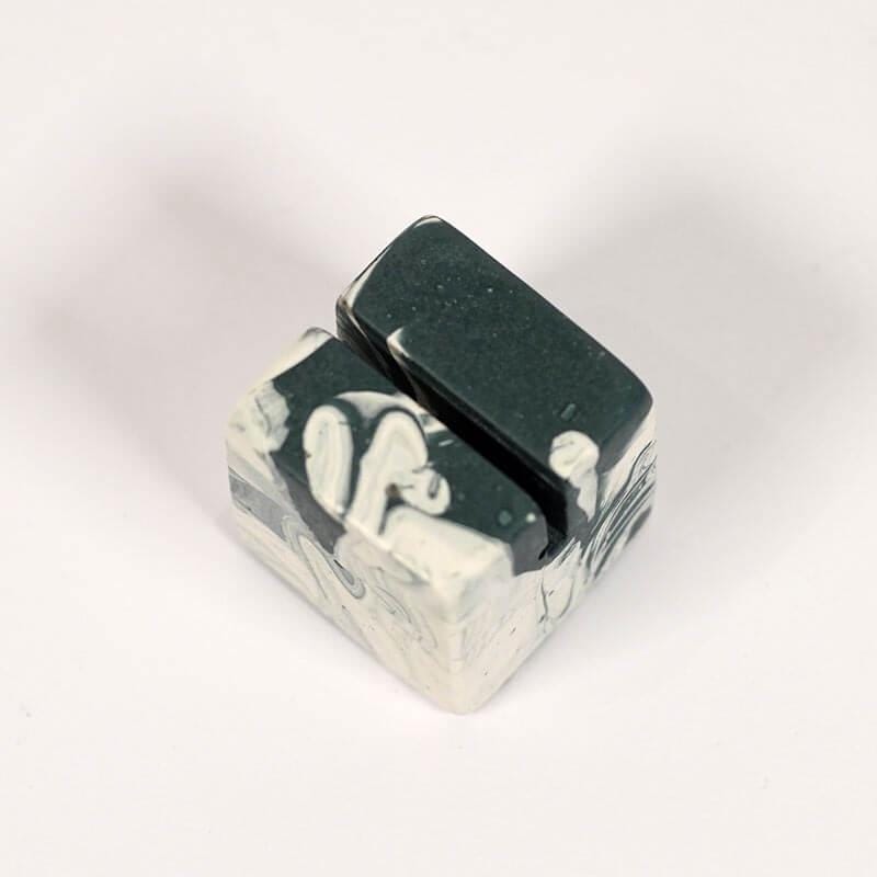 Marble patterned navy and white small photo holder on a white background