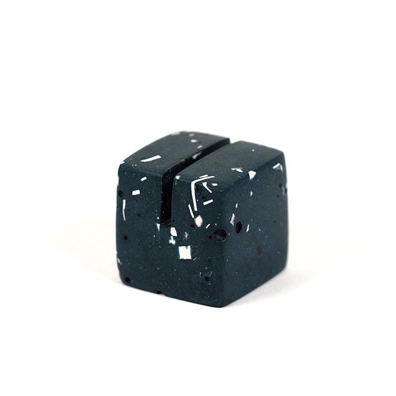 Black ceramic hexagonal object on a white background