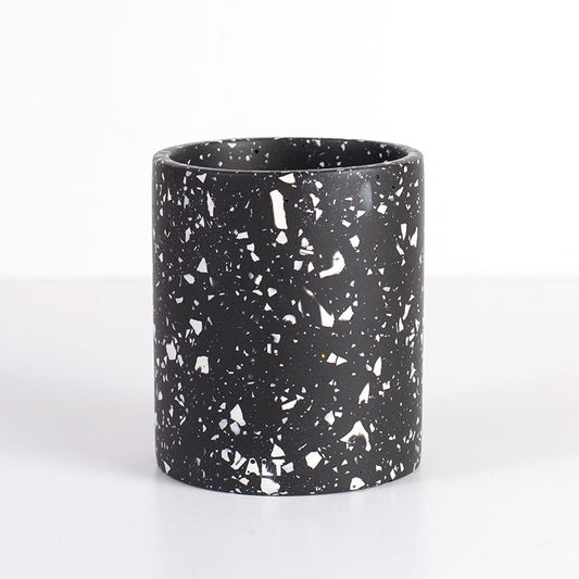 Black and white terrazzo pen pot on a white background
