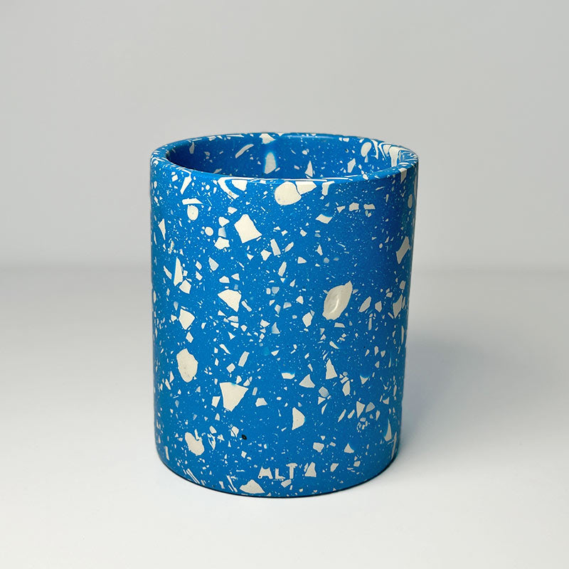 Blue terrazzo pen pot on a light grey background