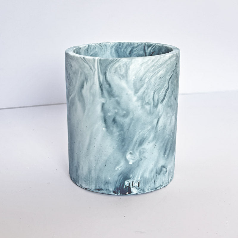 Marble-patterned pen pot with 'ALT' branding on a white background