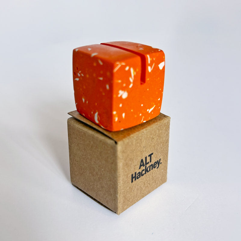 Orange Terrazzo Photo Holder on an eco brown box with 'ALT Hackney.' branding on a white background