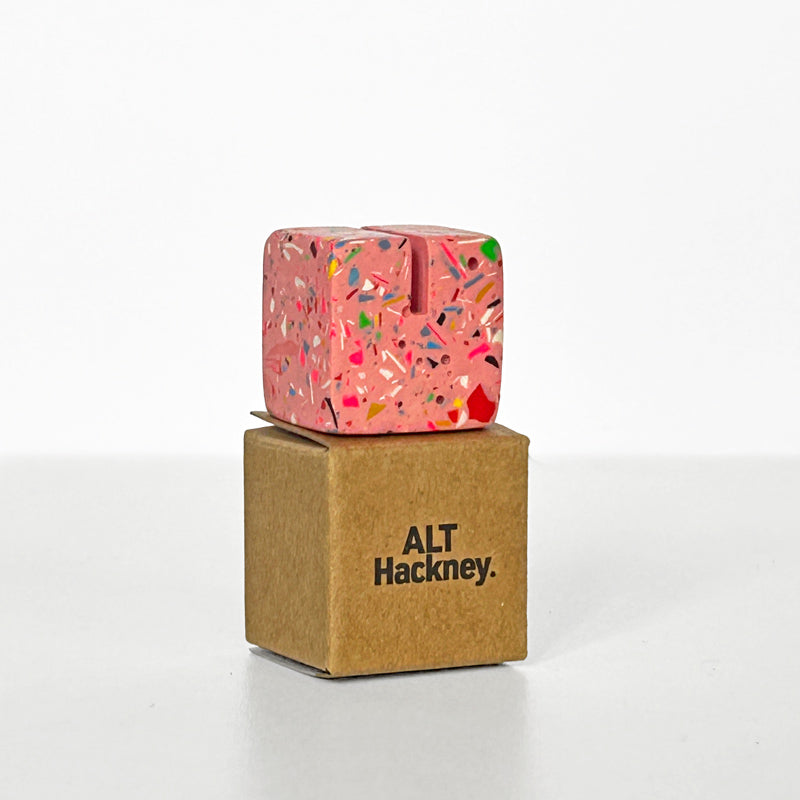 Pink Photo Holder with colourful rainbow terrazzo on a brown box with 'ALT Hackney' branding