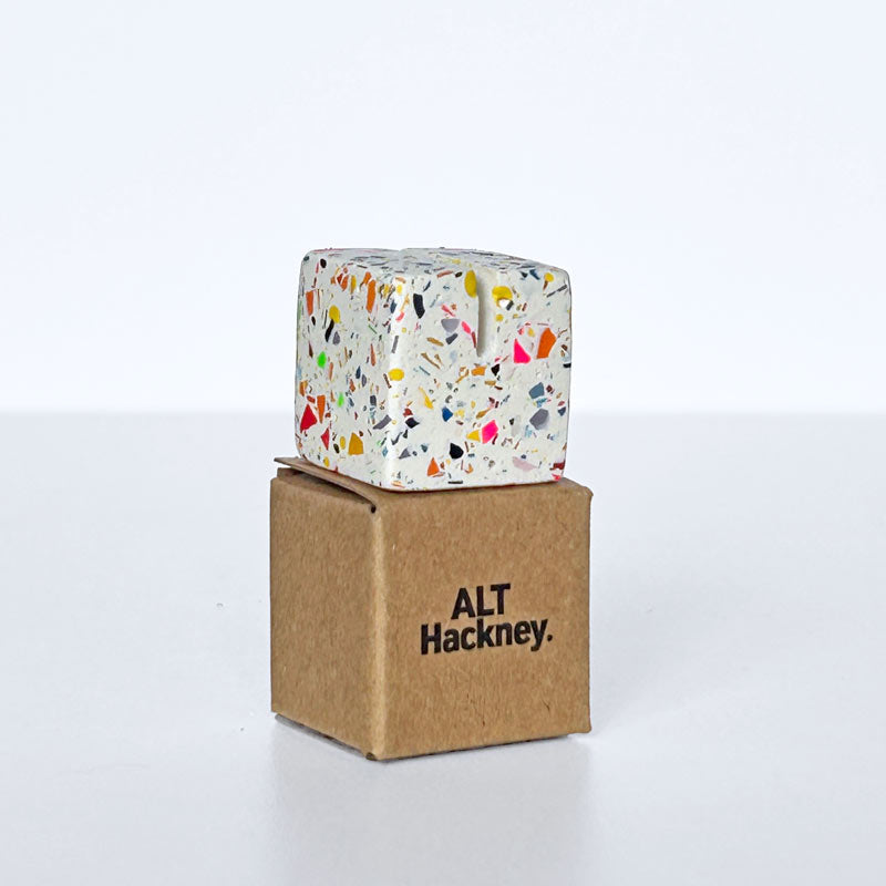Rainbow terrazzo photo holder on a brown eco box with 'ALT Hackney' branding on a white background