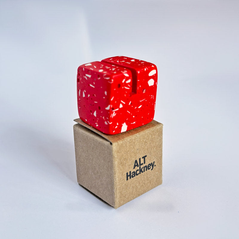 Red Terrazzo Photo Holder on an eco brown box with 'ALT Hackney.' branding on a white background