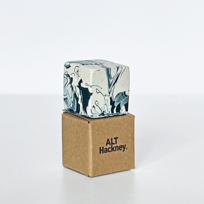 Marble patterned navy and white small photo holder on a cardboard box with 'ALT Hackney' branding on a white background
