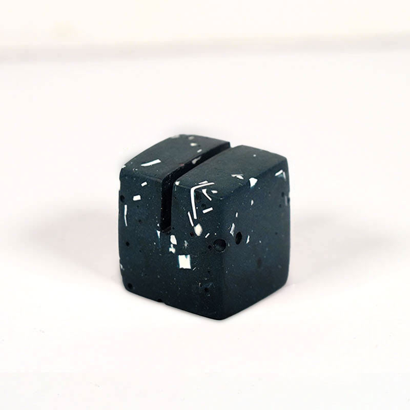 Black terrazzo small cube photo holder on a white background