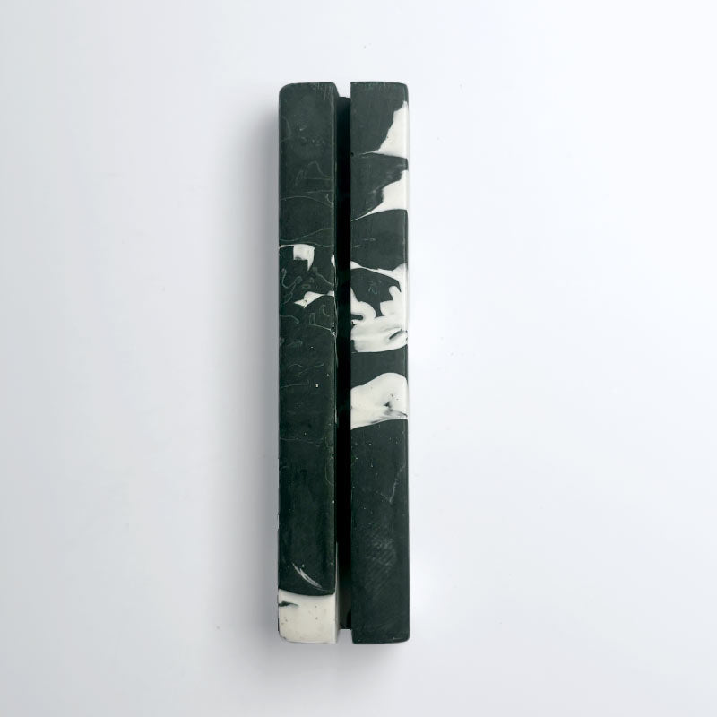 Dark green and white marble effect rectangular photo holder on a light gray background 