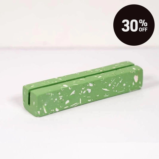 A Green rectangular object with speckled pattern on a white background with a black circular '30% OFF' promotional badge in the top right corner.