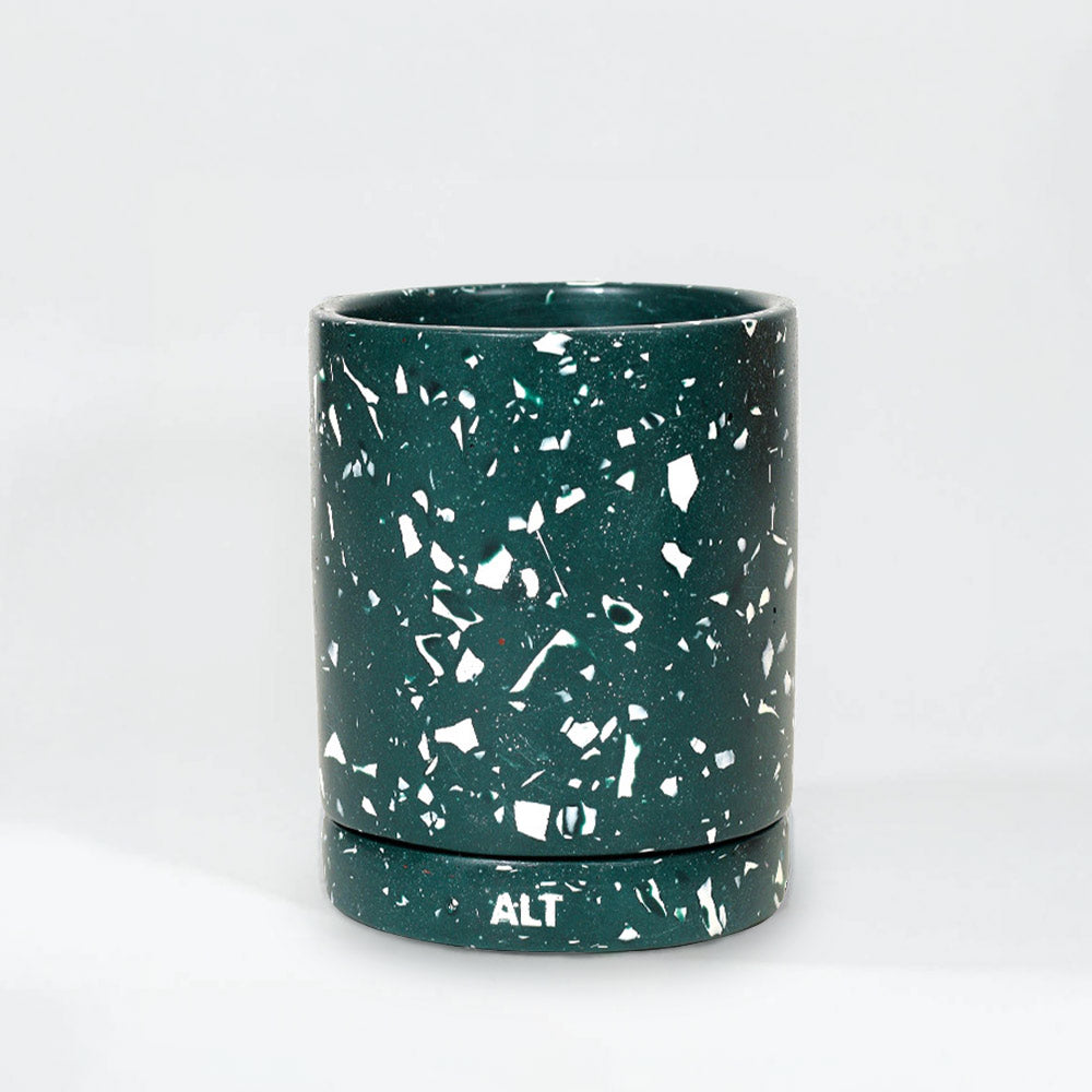 A dark green terrazzo with white speckles and a matching base, featuring the white printed letters 'ALT' on the bottom of the base, set against a plain white background.