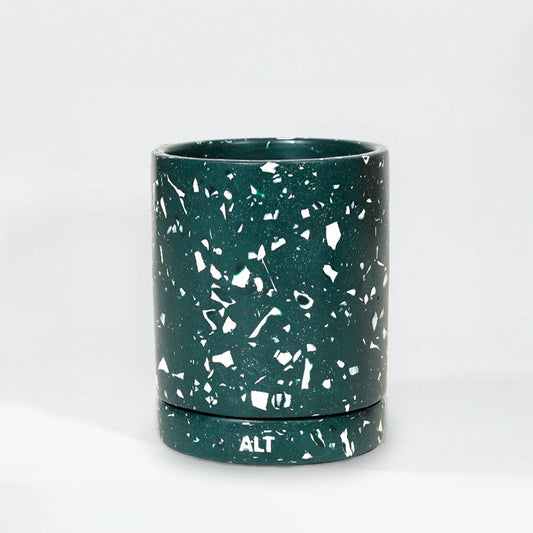 A dark green terrazzo with white speckles and a matching base, featuring the white printed letters 'ALT' on the bottom of the base, set against a plain white background.