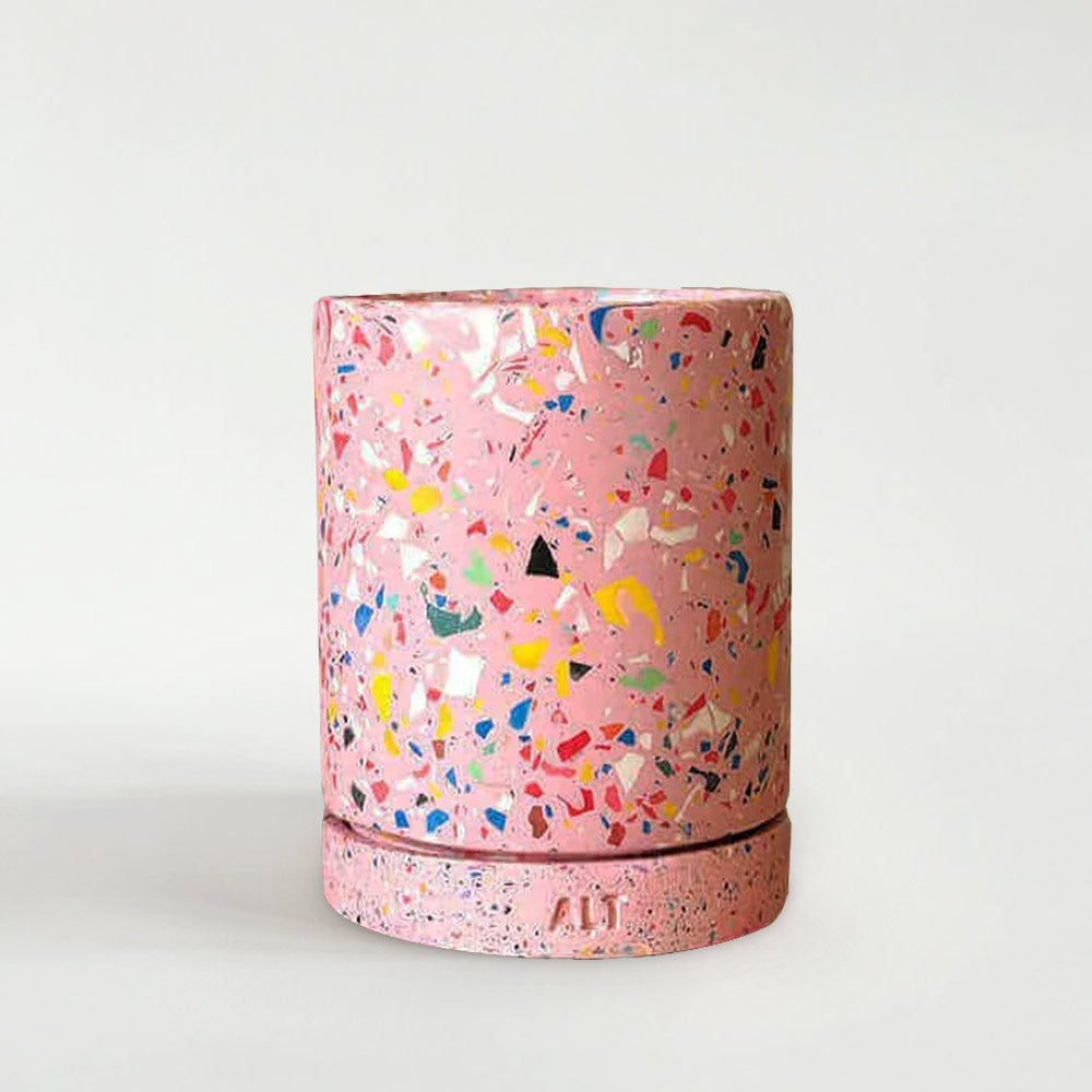 Pink rainbow terrazzo-patterned planter with a drainage hole and a water tray on a white background