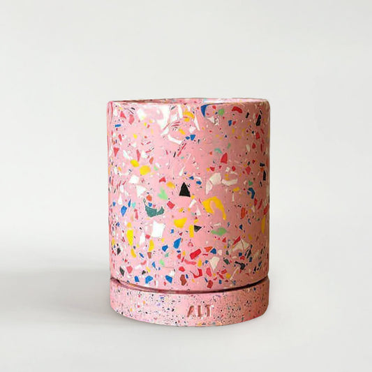 Pink rainbow terrazzo-patterned planter with a drainage hole and a water tray on a white background