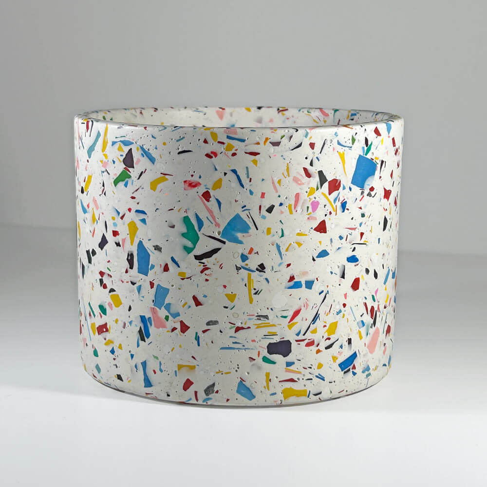 large rainbow terrazzo planter pot in a light grey background
