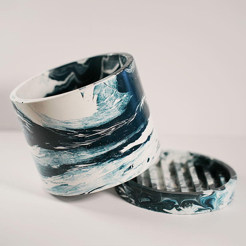 Navy marble-patterned plant pot with a separate tray on a white background