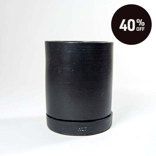 A black cylindrical plant pot with a separate saucer and a drainage hole, shown on a white background with a black circular '40% OFF' promotional badge in the top right corner.