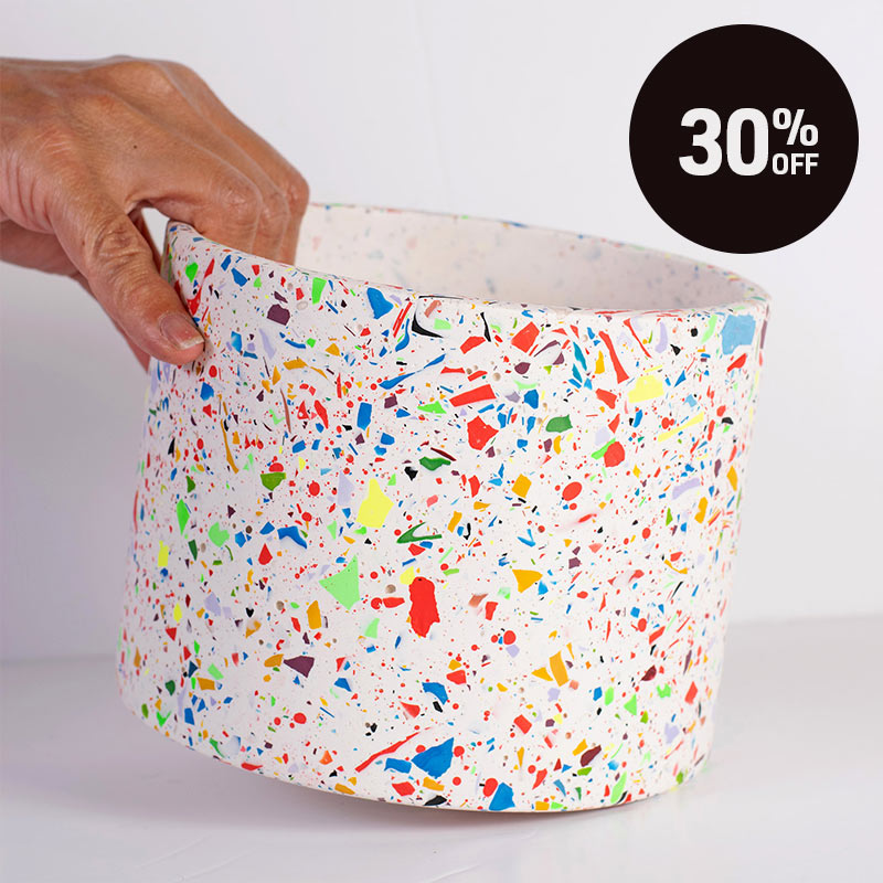 A hand holding a large rainbow terrazzo planter pot. A black circular badge in the top right corner reads '30% OFF'.