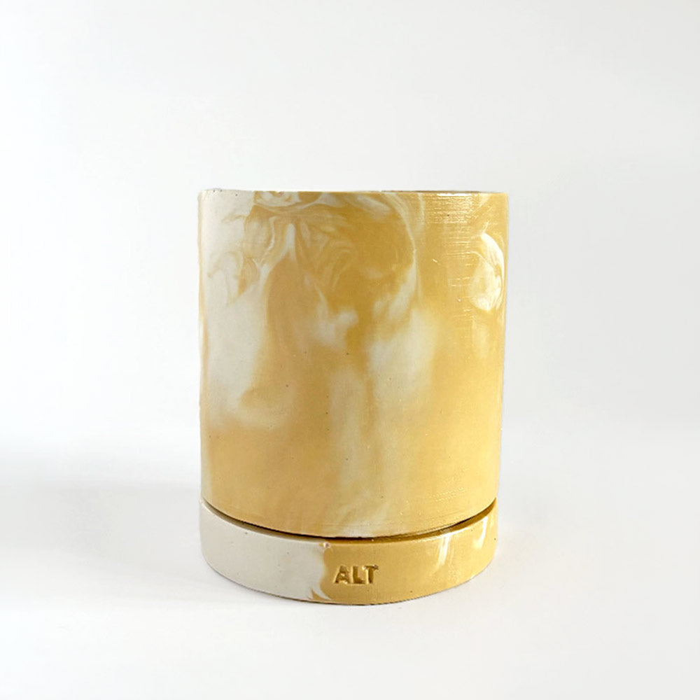 Marbled beige and white plant pot with drainage hole and a water tray with 'ALT' branding on a white background