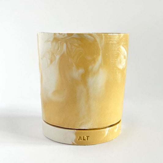 Marbled beige and white plant pot with drainage hole and a water tray with 'ALT' branding on a white background