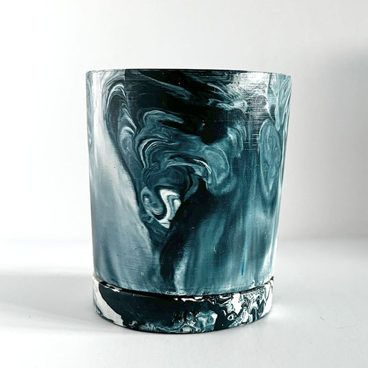 Navy marbled navy and white plant pot with a drainage hole and a water tray  on a white background