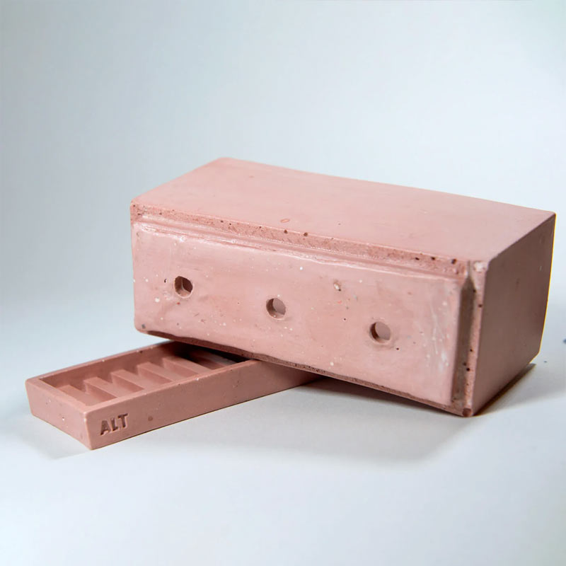 A rectangular dusty rose coloured planter pot with a matching saucer base, shown on a light grey background 